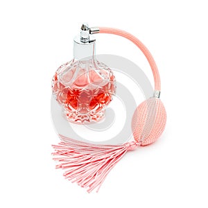 Pink perfume bottle on white background. Perfumery, cosmetics, fragrance collection.