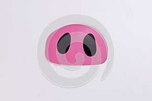 Pink pig nose piggie shape paper die cut selfie portrait party fun paper prop sticker stick on white background photo