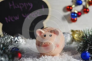 Pink piggy bank on christmas background