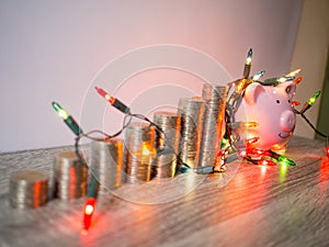 Pink piggy bank with coins pile growth graph and Party lights, Funly saving money for future investment plan and retirement fund