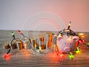 Pink piggy bank with coins pile growth graph and Party lights, Funly saving money for future investment plan and retirement fund