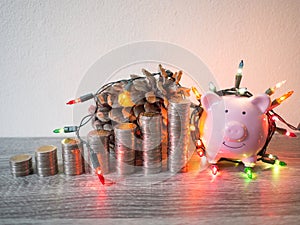 Pink piggy bank with coins pile growth graph and Party lights, Funly saving money for future investment plan and retirement fund