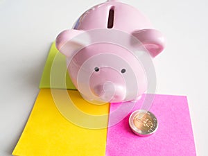 Pink Piggy bank and paper note with coin, Saving money for future plan and retirement fund concept