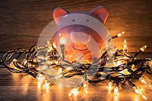 Pink piggy bank with party light, organize a party for the event where successful in saving money for use in various festivals