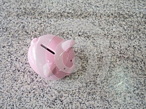 Pink piggy bank standing on marble floor, step up to start up business to success, Saving money for future plan and retirement