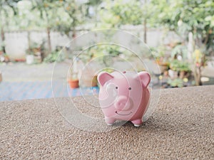 Pink piggy bank standing. step up start up business to success, Saving money for future plan and retirement fund concept
