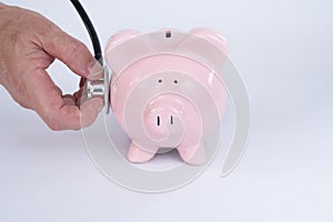 Pink Piggy Bank with Stethoscope