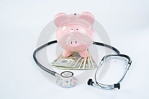 Pink Piggy Bank with Stethoscope and Money