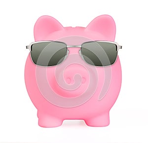 Pink piggy bank in a sunglasses front view isolated on white