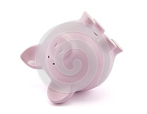 Pink piggy bank upside down