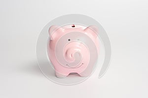 Pink piggy bank on a white background