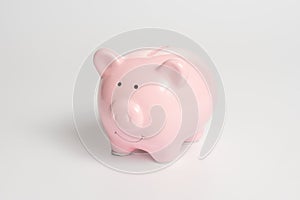 Pink piggy bank on a white background