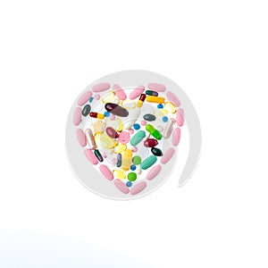 Pink pills in the shape of a heart on a white isolated background. One-to-one square shot for social networks. Heart