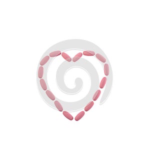 Pink pills in the shape of a heart on a white isolated background. One-to-one square shot for social networks. Heart