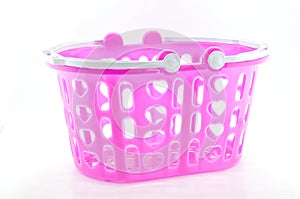Pink plastic basket isolated.