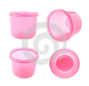 Pink plastic beaker cup isolated over the white background