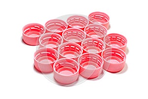 Pink plastic bottle caps