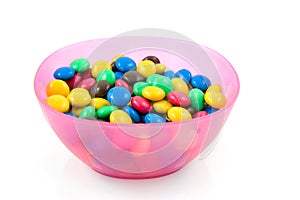 Pink plastic bowl with chocolate candy