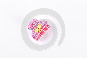 Pink plastic hair clip on white background.