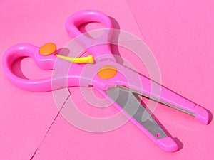 Pink plastic scissors