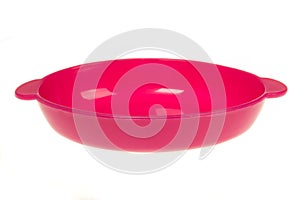 Pink plastic wash bowl / basin isolated on white background