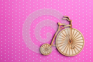 Pink polka dot background with bike