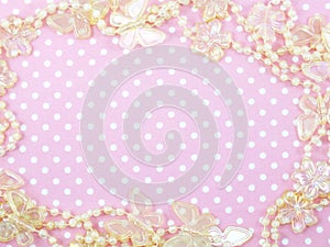 Pink polka dot background and butterflied decoration photo