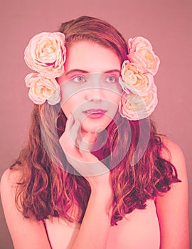 Pink portrait of girl with flowers in hair