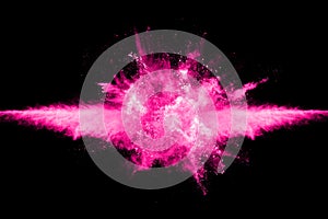 Pink powder explosion on black background.