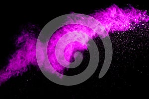 Pink powder explosion on black background. Halloween background