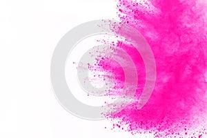 Pink powder explosion isolate on white background. Paint Holi.