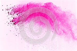 Pink powder explosion isolate on white background. Paint Holi.