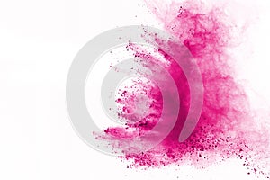 Pink powder explosion isolate on white background. Paint Holi.