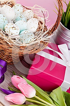 Pink present and colorful tulips festive easter decoration