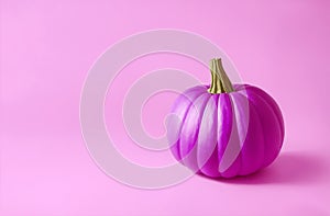 Pink pumpkin on a pale pink background. Barbie style.