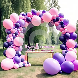 pink purple balloon arch, balloons in shape of frame, outdoors girl birthday party, decorations, cake on candybar