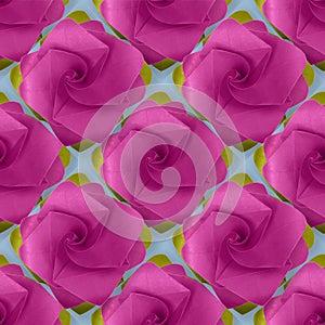 Pink purple paper origami handmade rose on blue pattern