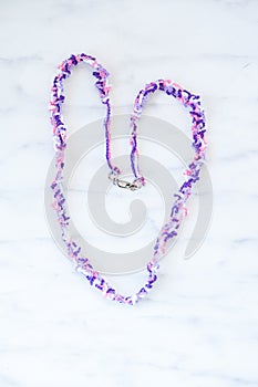 Pink, purple and white crocheted necklace