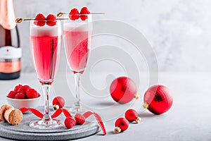 Pink Raspberry Mimosa Cocktail with champagne or prosecco