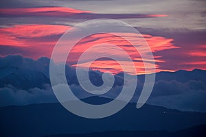 pink red clouds in sunrise mountain mitsikeli in winter moring ioannina greece