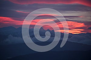 pink red clouds in sunrise mountain mitsikeli in winter moring ioannina greece