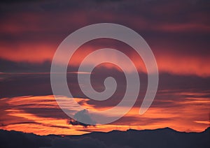 pink red clouds in sunrise mountain mitsikeli in winter moring ioannina greece