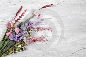 Pink, red and purple flower corsage photo
