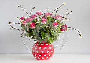 Pink red roses and buttercups photo