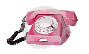 Pink retro phone isolated on white background. Telephone with rotary dial