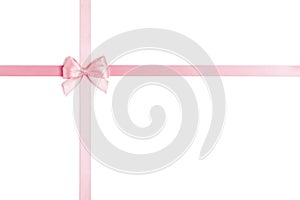 Pink ribbon with bow isolated on white background.