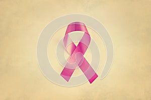 Pink ribbon, breast cancer awareness symbol, Vintage on paper grain background