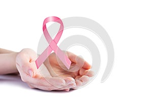 Pink ribbon on hands for breast cancer awareness
