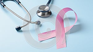 Pink ribbon with stethoscope, breast cancer awareness month
