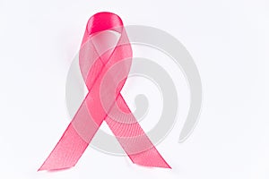 Pink ribbon on white background. Breast Cancer Awareness Month. Women's health care concept. Symbol of hope and